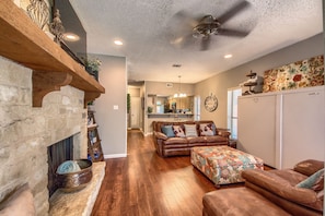 Living Room with smart TV and Queen Murphy Bed.