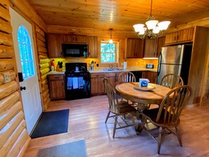 Rustic charm meets modern comfort in the kitchen and dining area