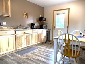 Kitchenette with dining table.