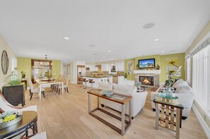 Families can comfortably spread out throughout all three levels of this vacation home that's just one house from the beach!
                