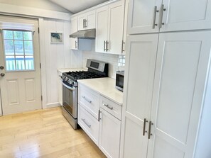 Cute, updated kitchen.  New cabinets, floors and appliances