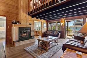 Relax in the beautiful Living Area with high ceilings and hardwood flooring.