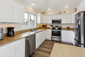 Whip up something delicious in the Kitchen with modern appliances and plenty of prep space.