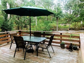 Back deck, off kitchen, with gas grill.