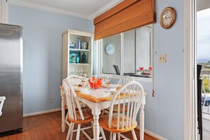 Cozy dining table with mountain and ocean views