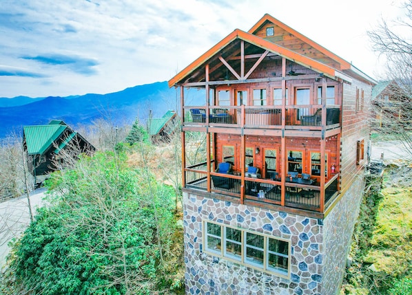 Enjoy spectacular mountain views from two large decks, firepit, comfy seating, hot tub and edison lights at night.