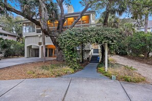 Exterior of house- surrounding by the lush lowcountry trees