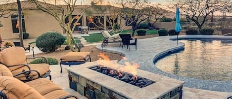 Firepit overlooking pool while you watch the sunset over Black Mountain