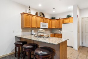 Full Kitchen with Extra Bar Seating