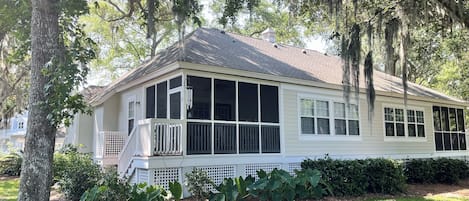 Perfect back porch to sip your coffee, listen to the birds and watch some golf. 