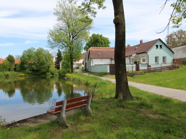 Water, Sky, Cloud, Plant, Building, Window, Outdoor Bench, Green, Tree, Natural Landscape