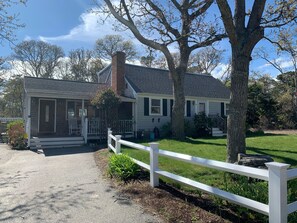 Awesome front porch with rockers as well as fenced in yard.