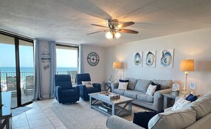 Living Room features two reclining chairs and two queen sized sofa sleepers