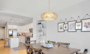 The attached dining area has seating for six at the table as well as two seats at the kitchen island.
