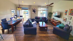 Open-concept living space, where comfort awaits. 2 spacious sofas & table for 10