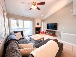 65 inch tv, large sectional couch and river views
