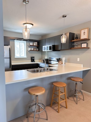 Lots of counter top space! Fully open to living room.