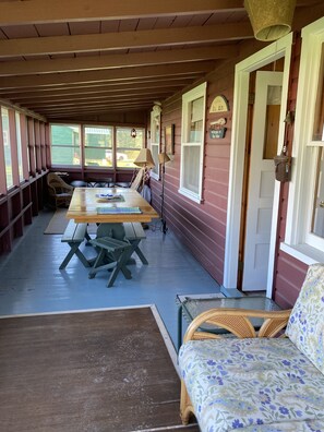 Screened in front porch. Single bed on the far end for napping 