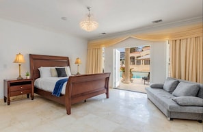 Bedroom with direct access to the pool area.