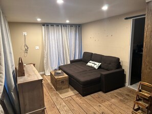 Couch pulls out to queen size bed with storage chaise lounge chair.