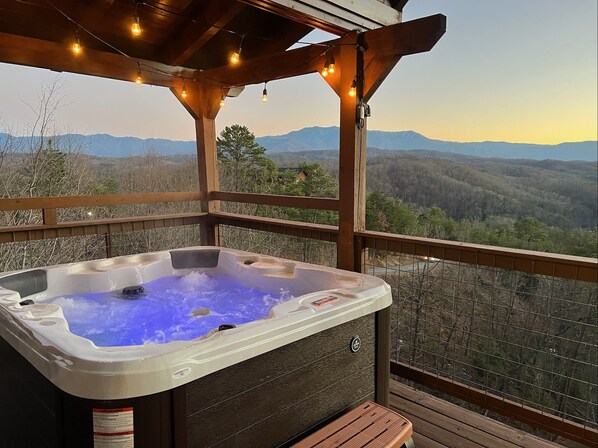 Soak in the panoramic sunset in the four-person hot tub. 