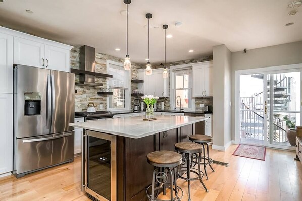 A chef's dream kitchen, with slide in range and huge island, this is the perfect spot for dining and entertaining