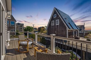 Balcony right off the primary bedroom with outdoor seating and to enjoy the ocean views