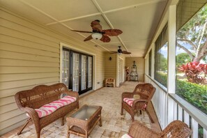 Screened front porch and seating area.