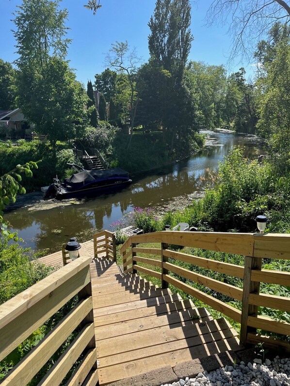 new steps/dock 2024 enjoy the view of the Pigeon river in your backyard-