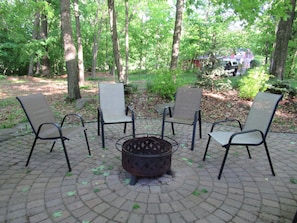 Private patio (14 chairs provided) 
with fire pit.  Wood provided.