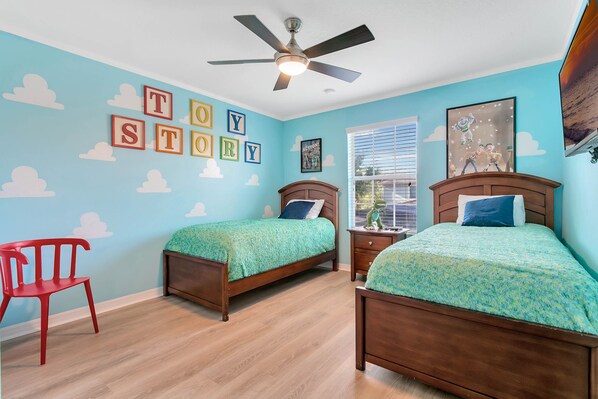 Bedroom #4 toy story room with two twin beds and Smart TV on second floor