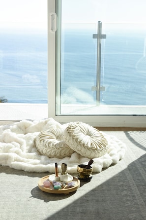 The living room is the perfect meditation spot. Enjoy the smells of palo santo, sage, and more. Play the Tibetan singing bowl and enjoy the crystals.