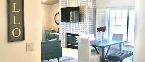 Main Room with Views of the Pool, vaulted ceilings and cozy fireplace.