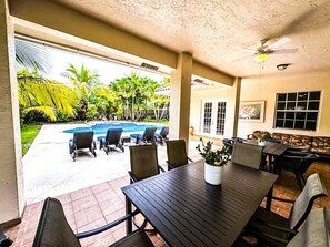 Lanai with Grill & Dining Area By The Pool