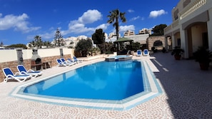 Large deck around the pool, Accommodation overlooking the swimming pool.