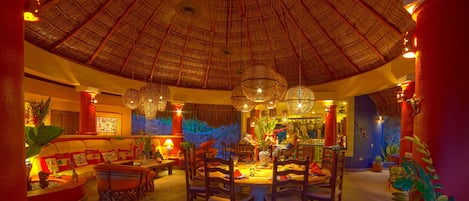 Sala Grande, a. k. a. The Main Palapa — Table set for eight.