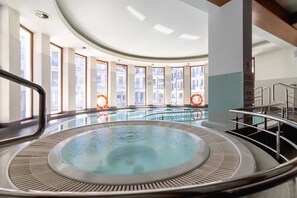 Luxurious pool and jacuzzi in the common area.