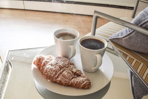 Steaming coffee and bakery items are a great way to start your day by the sea.