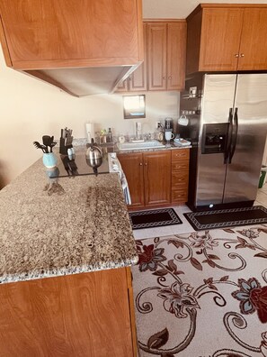 Kitchen with “ get you started” coffee, tea and snacks area

