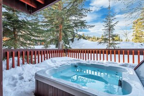 6-person private jacuzzi is on the deck right off of the Primary Bedroom