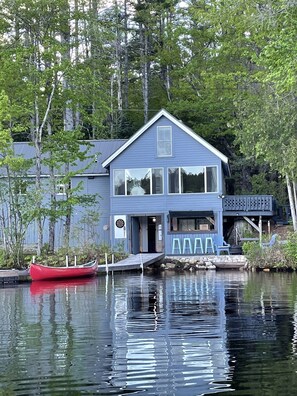 View of cottage from the lake in a kayak