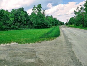 Guesthouse on corner of our farm. Huge driveway + road leads to Keuka Lake