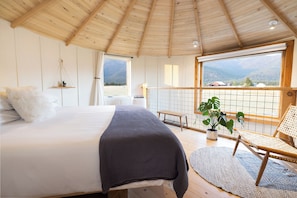 Light and airy main bedroom with a king bed