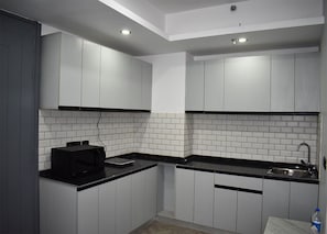 Kitchen of Serviced Apartment by BedChambers in Gurgaon.