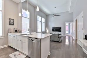 14ft ceiling with oversize windows bringing in  natural bright lights 