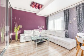 Living room with a comfortable sofa and TV.