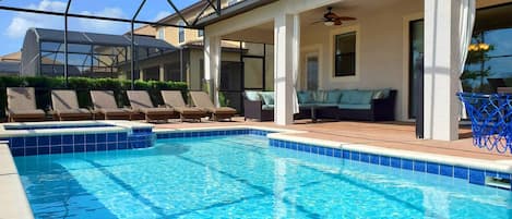 Enclosed saltwater pool & spa, privacy bushes 6 lounge chairs outdoor sectional