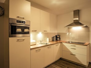 Cabinetry, Countertop, Kitchen, Building, Kitchen Appliance, Lighting, Wood, Interior Design, Drawer, Flooring