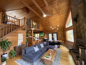 Living room with projector and fireplace 