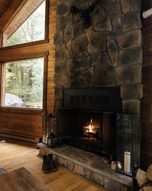 Wood burning fireplace overlooking the forest
